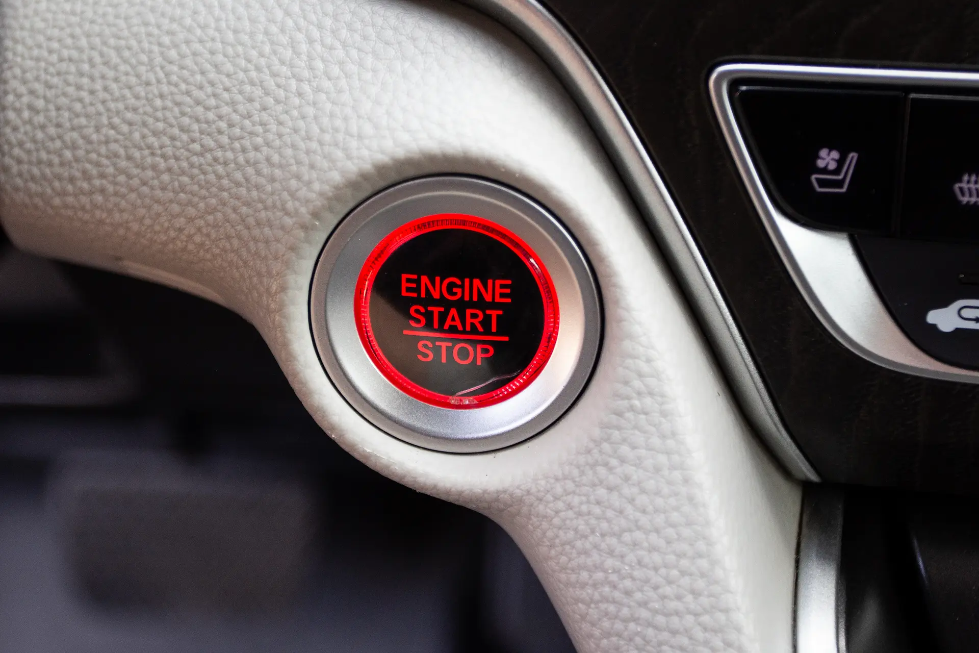 Engine start stop button